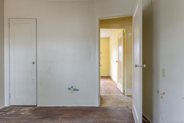 hall with wood-type flooring