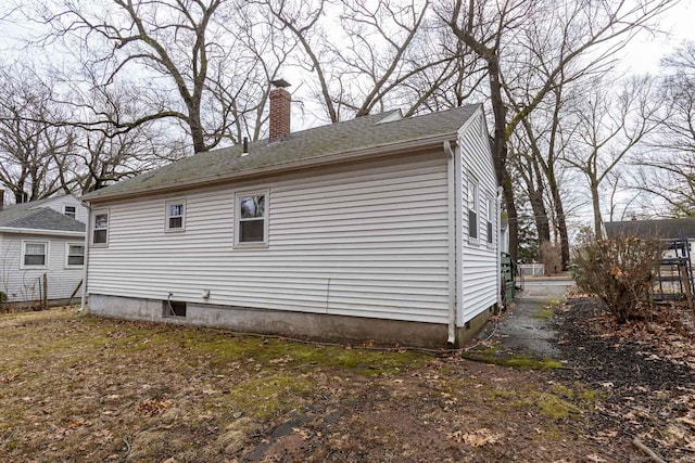 view of side of property with a chimney