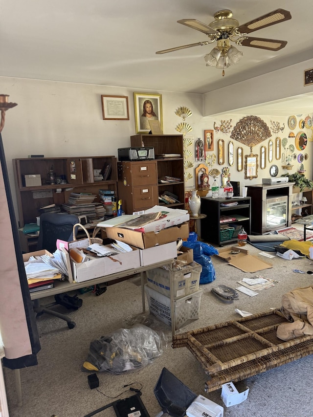 miscellaneous room featuring ceiling fan and carpet