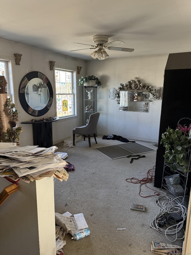 interior space with ceiling fan and carpet floors