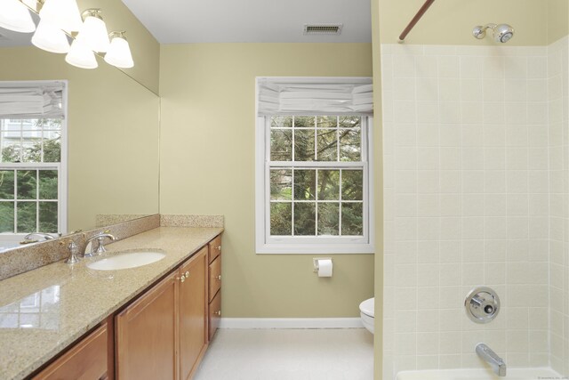 full bath featuring visible vents, an inviting chandelier, tub / shower combination, baseboards, and vanity