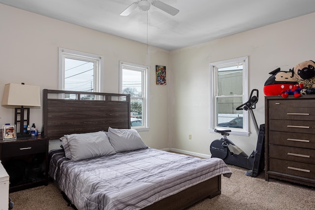 bedroom with a ceiling fan and carpet floors