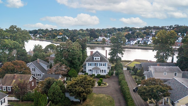 bird's eye view featuring a water view and a residential view