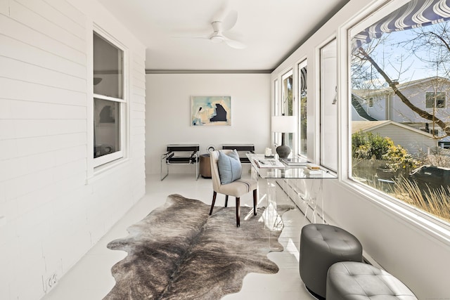 living area featuring ceiling fan