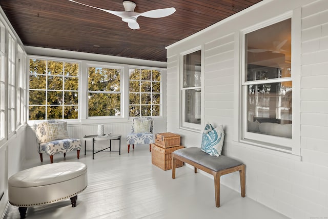 sunroom / solarium featuring wood ceiling and ceiling fan