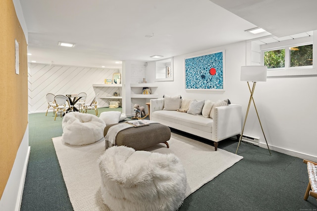 carpeted living area featuring baseboards, baseboard heating, and a fireplace