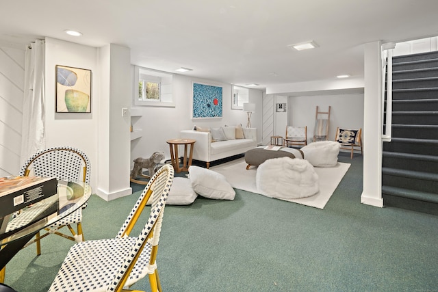 carpeted living area featuring recessed lighting and stairs