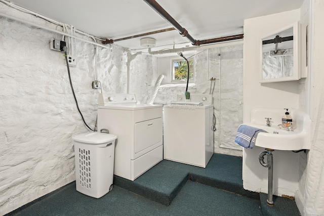 bathroom featuring independent washer and dryer and walk in shower