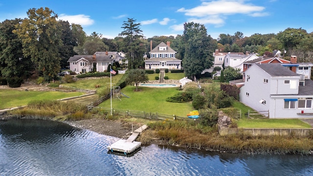 birds eye view of property featuring a residential view and a water view