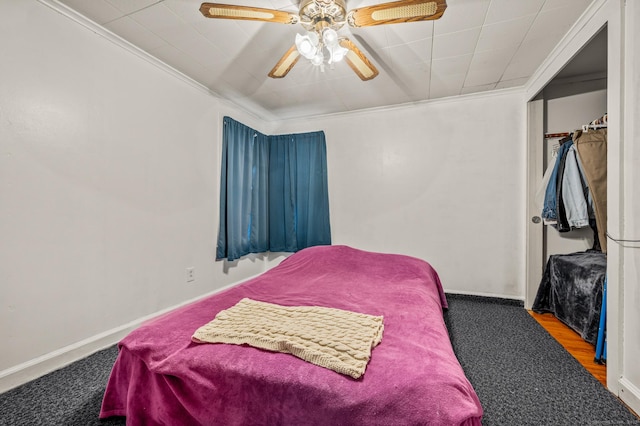 bedroom featuring a ceiling fan, baseboards, and ornamental molding