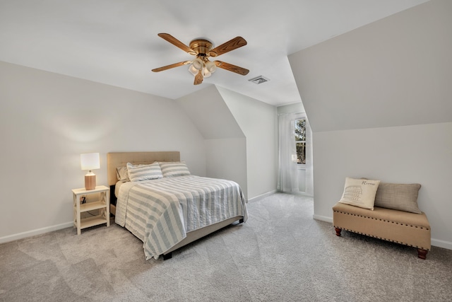 carpeted bedroom with visible vents, a ceiling fan, lofted ceiling, and baseboards