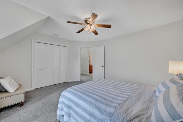 bedroom with visible vents, ceiling fan, carpet, lofted ceiling, and a closet