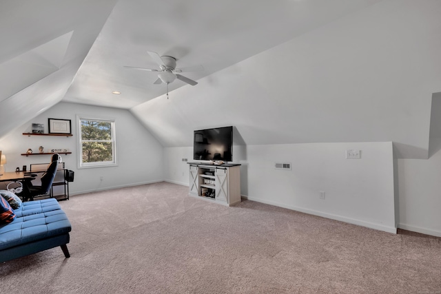 home office featuring light carpet, baseboards, a ceiling fan, and lofted ceiling