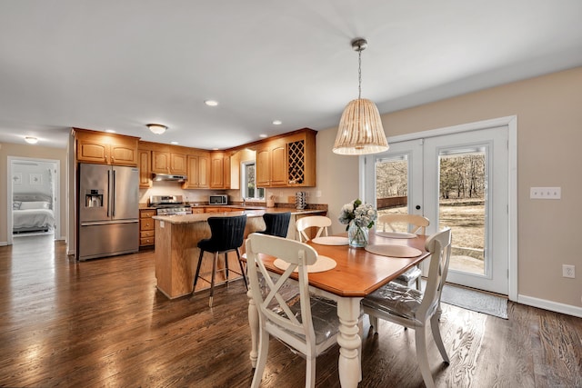 dining room with dark wood finished floors, recessed lighting, french doors, and baseboards