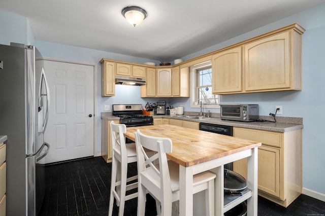 kitchen featuring light brown cabinets, a sink, stainless steel appliances, under cabinet range hood, and wood counters