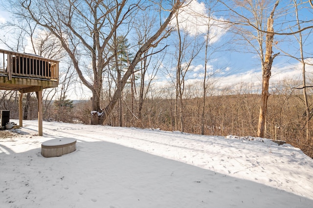 view of yard layered in snow