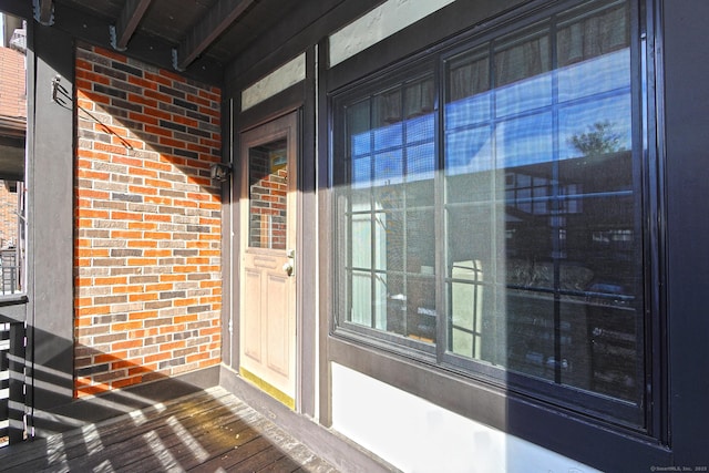 entrance to property with brick siding