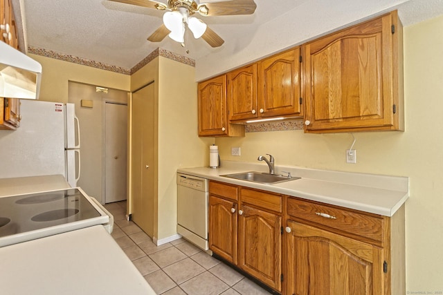 kitchen with white appliances, light tile patterned flooring, a sink, extractor fan, and light countertops