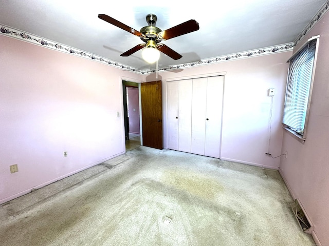 unfurnished bedroom featuring visible vents, baseboards, a closet, and a ceiling fan