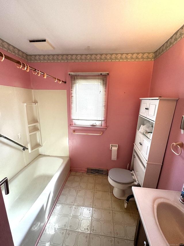 full bathroom with vanity, visible vents, baseboards, shower / tub combination, and toilet