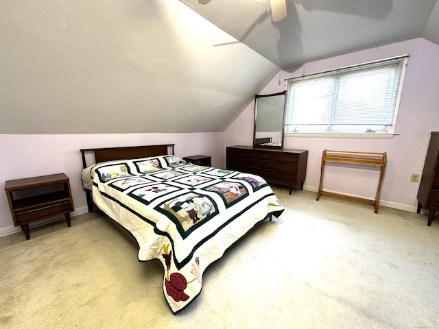 bedroom with carpet flooring, ceiling fan, baseboards, and lofted ceiling