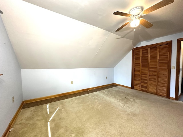 bonus room with ceiling fan, baseboards, lofted ceiling, and carpet floors