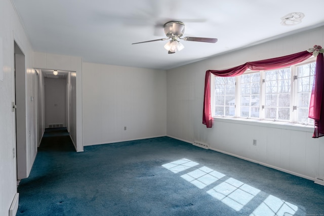 unfurnished bedroom with visible vents, multiple windows, carpet, and ceiling fan