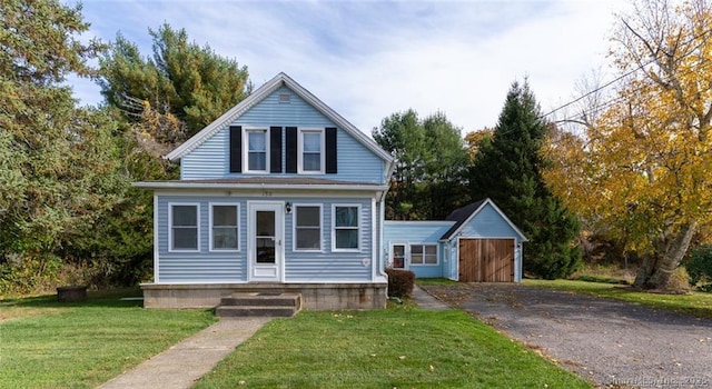 view of front facade with a front lawn and an outbuilding