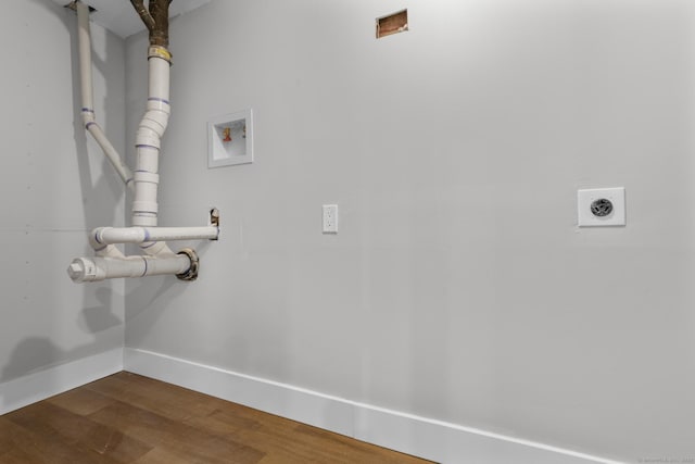 washroom featuring baseboards, hookup for an electric dryer, dark wood finished floors, laundry area, and washer hookup