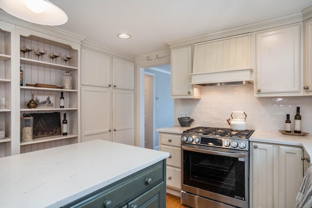 kitchen featuring custom exhaust hood, open shelves, recessed lighting, decorative backsplash, and stainless steel gas range oven