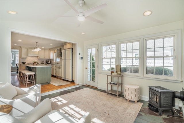 interior space with recessed lighting, baseboards, lofted ceiling, and ceiling fan