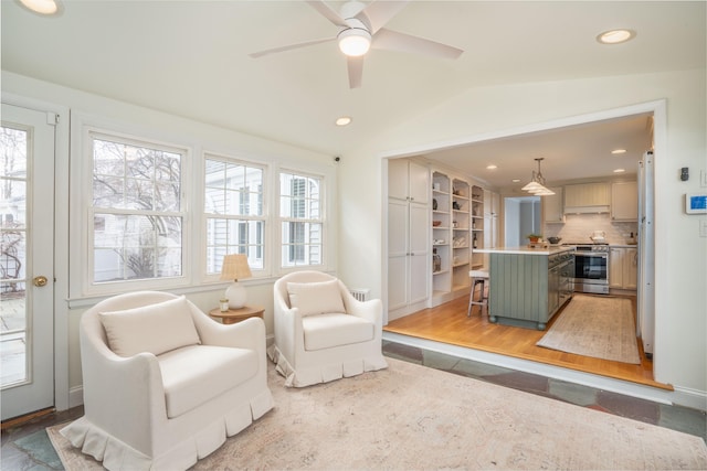 sitting room featuring lofted ceiling, recessed lighting, and ceiling fan