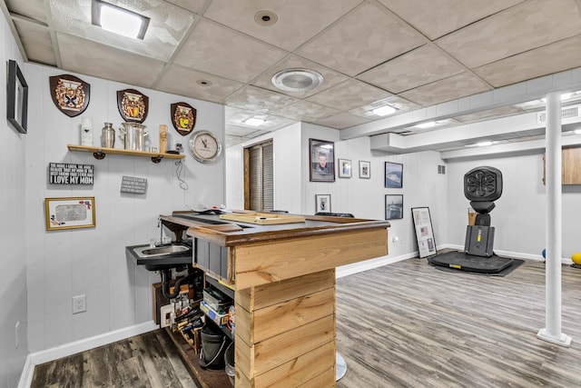 rec room featuring visible vents, wood finished floors, baseboards, and a drop ceiling