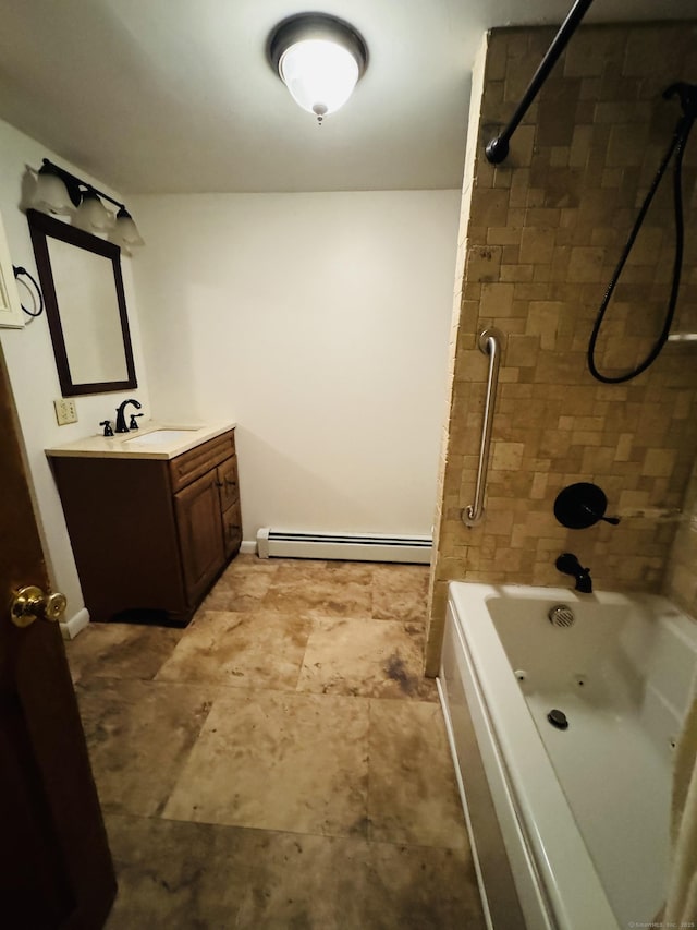 full bath featuring a baseboard heating unit, bathing tub / shower combination, vanity, and baseboards