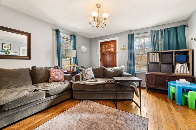 living room featuring hardwood / wood-style flooring and a chandelier