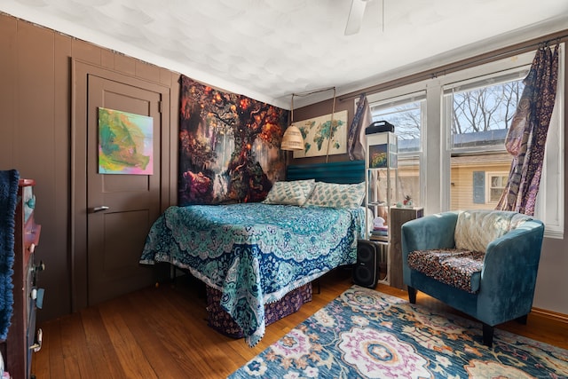 bedroom featuring ceiling fan and hardwood / wood-style flooring