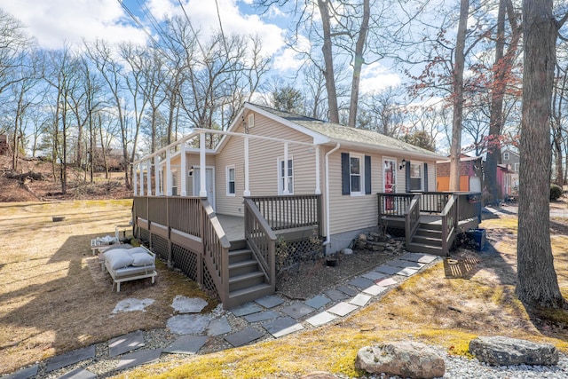 view of front of home featuring a wooden deck