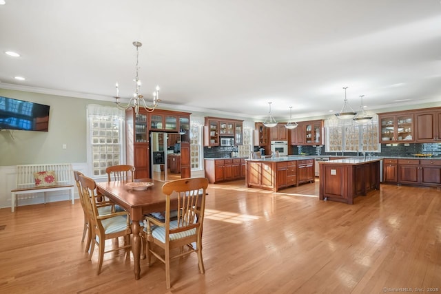 35 Grace View Dr, Easton, CT 06612 - dining room featuring a chandelier, ornamental molding, light wood-style floors, a wainscoted wall, and recessed lighting