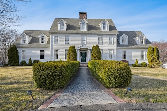 35 Grace View Dr, Easton, CT 06612 - georgian-style home featuring a front lawn, a chimney, and roof with shingles