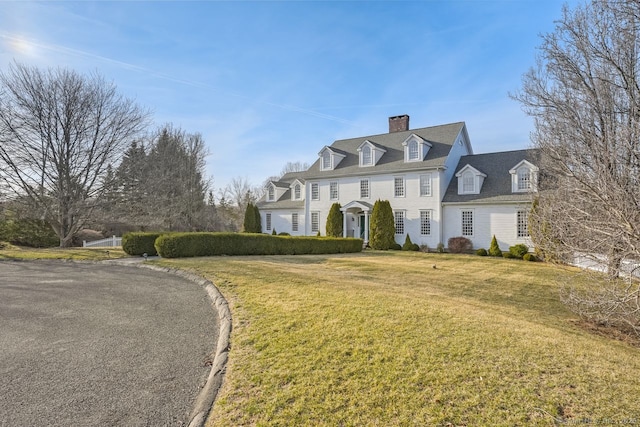 35 Grace View Dr, Easton, CT 06612 - view of front of home with a chimney and a front lawn