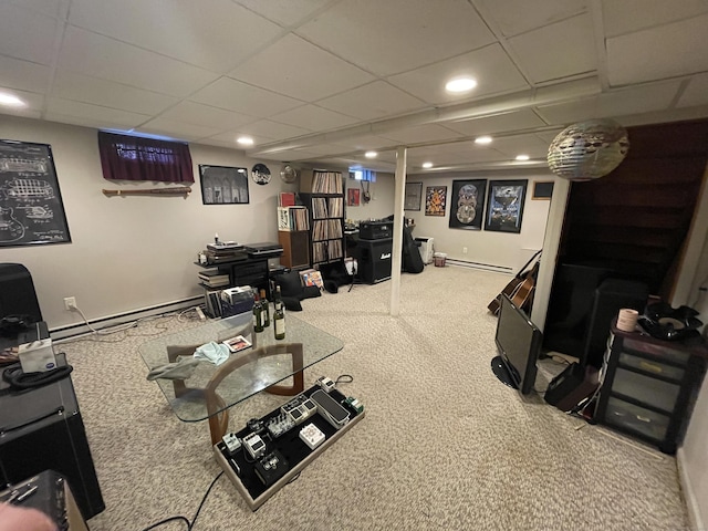 interior space featuring carpet flooring, a paneled ceiling, and a baseboard radiator