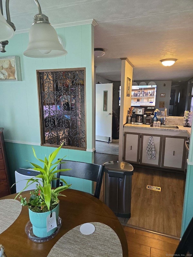 301 Buddington Rd Lot 49, Groton, CT 06340 - dining room with wood finished floors, crown molding, and a textured ceiling