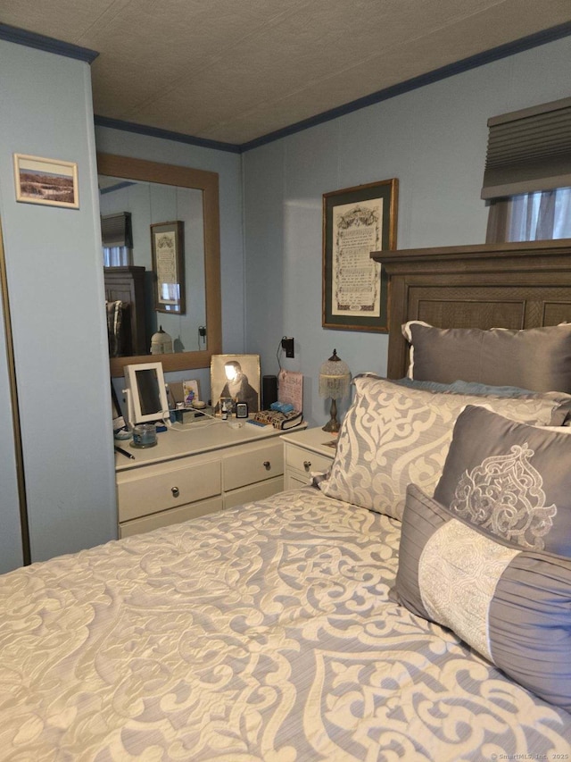 bedroom featuring crown molding