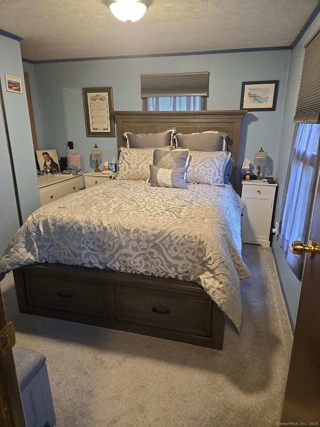 carpeted bedroom with ornamental molding