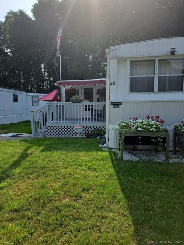 view of yard with a wooden deck