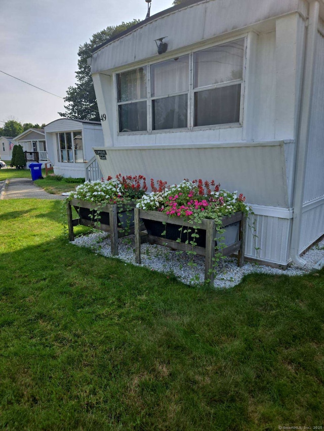 301 Buddington Rd Lot 49, Groton, CT 06340 - view of side of home with a yard