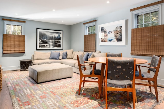 living area with visible vents, recessed lighting, baseboards, and wood finished floors