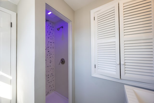 bathroom with a shower stall