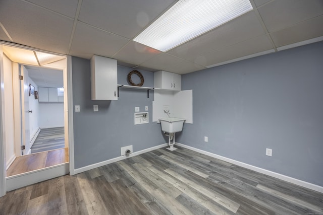 clothes washing area with wood finished floors, baseboards, hookup for an electric dryer, hookup for a washing machine, and laundry area