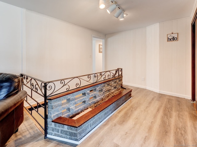 interior space featuring baseboards and wood finished floors